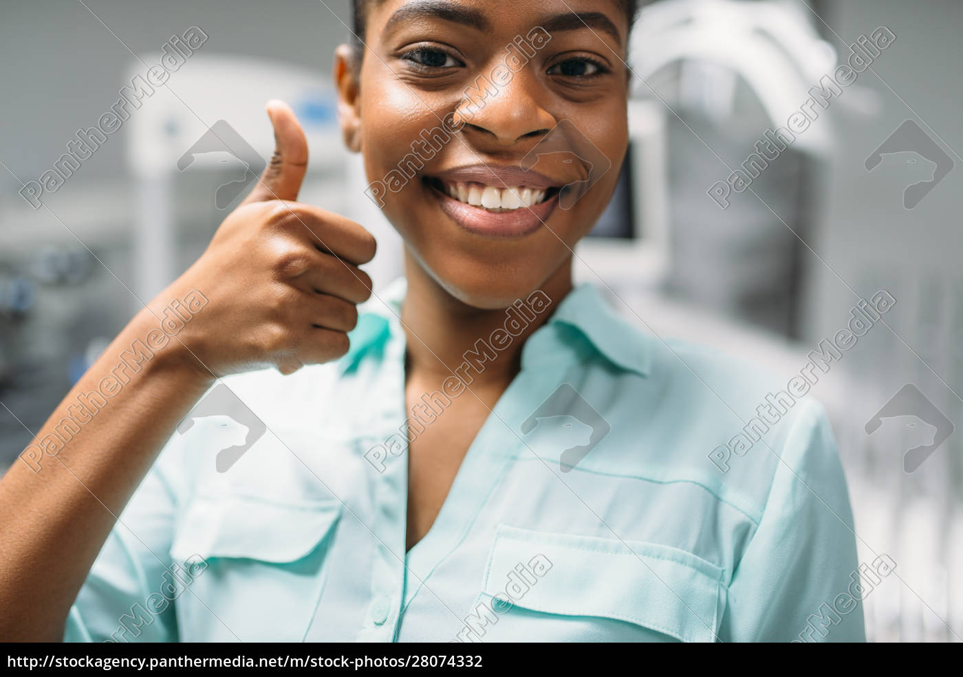 Female Patient Shows Thumbs Up In Dental Clinic Lizenzfreies Foto