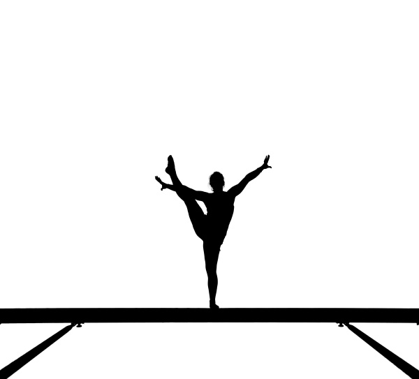 silhouette einer turnerin auf dem balken