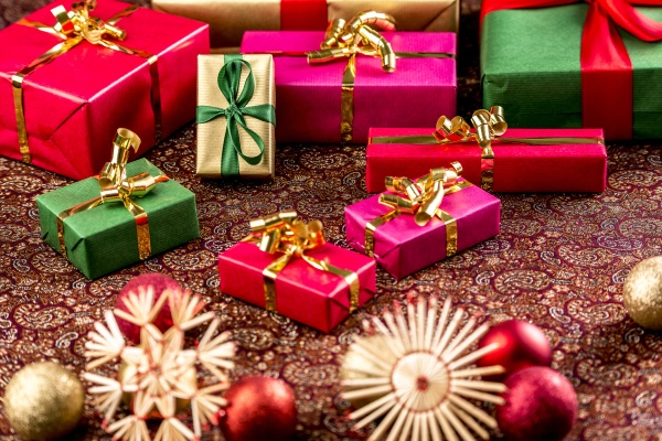 christmas gifts on richly textured cloth