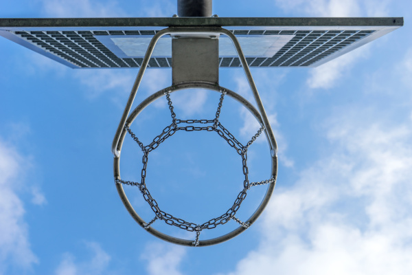 basketball hoop against a blue sky