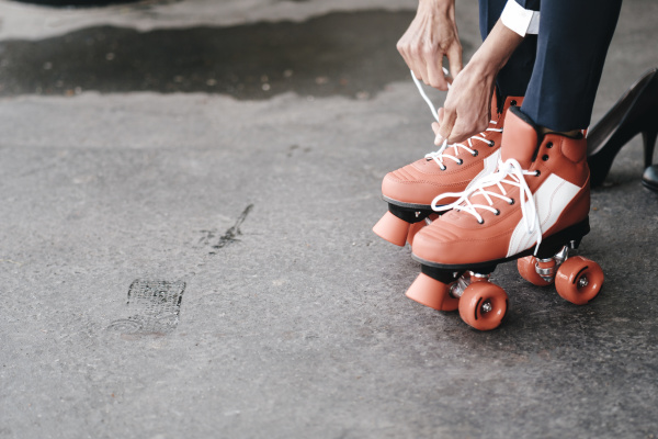 businesswoman tying her roller skates 2c