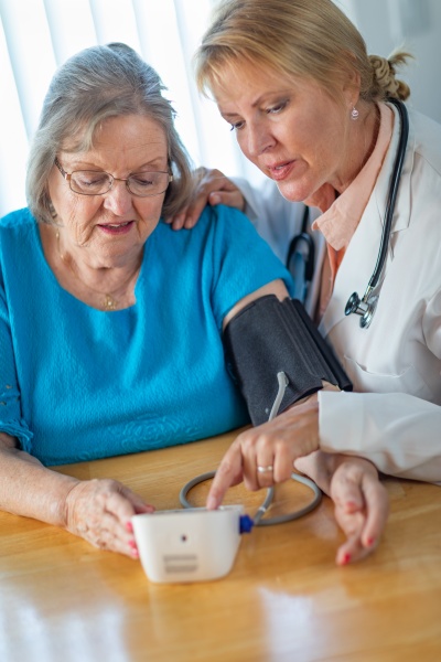 senior adult woman learning from female
