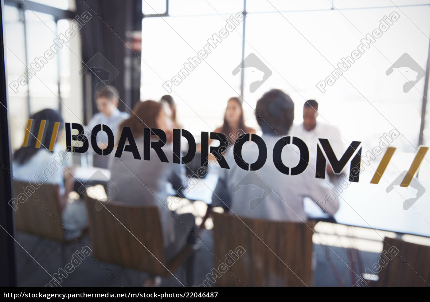 Stockfoto 22046487 Team In A Boardroom Meeting Defocussed Through Glass Wall